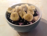 Breakfast bowl with banana and other fruit