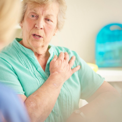woman pointing her arm with medical professional