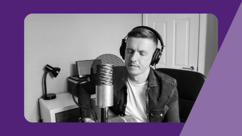 Danny in front of a microphone