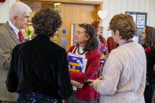 Welsh Health Minister speaking with Dr Barney Hawthorne, Crohn's and Colitis UK Chair of Trustees and CEO