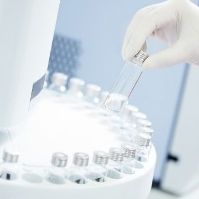 Research Lab - Scientist using medicial tubes in a machine