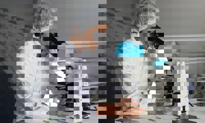 Man Using Microscope