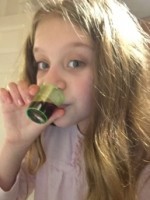 Evie taking her medication