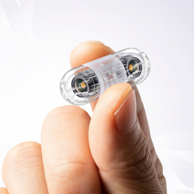 hand holding pill camera