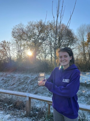 Kirsten holding award