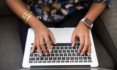 Person Typing On Laptop Keyboard 