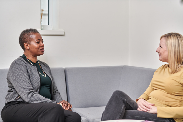 Two women sat talking