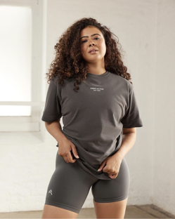 Natalie-Amber stands in a white room, looking to camera